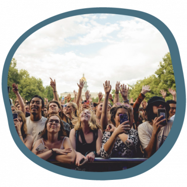 Crowd of happy people at live music event