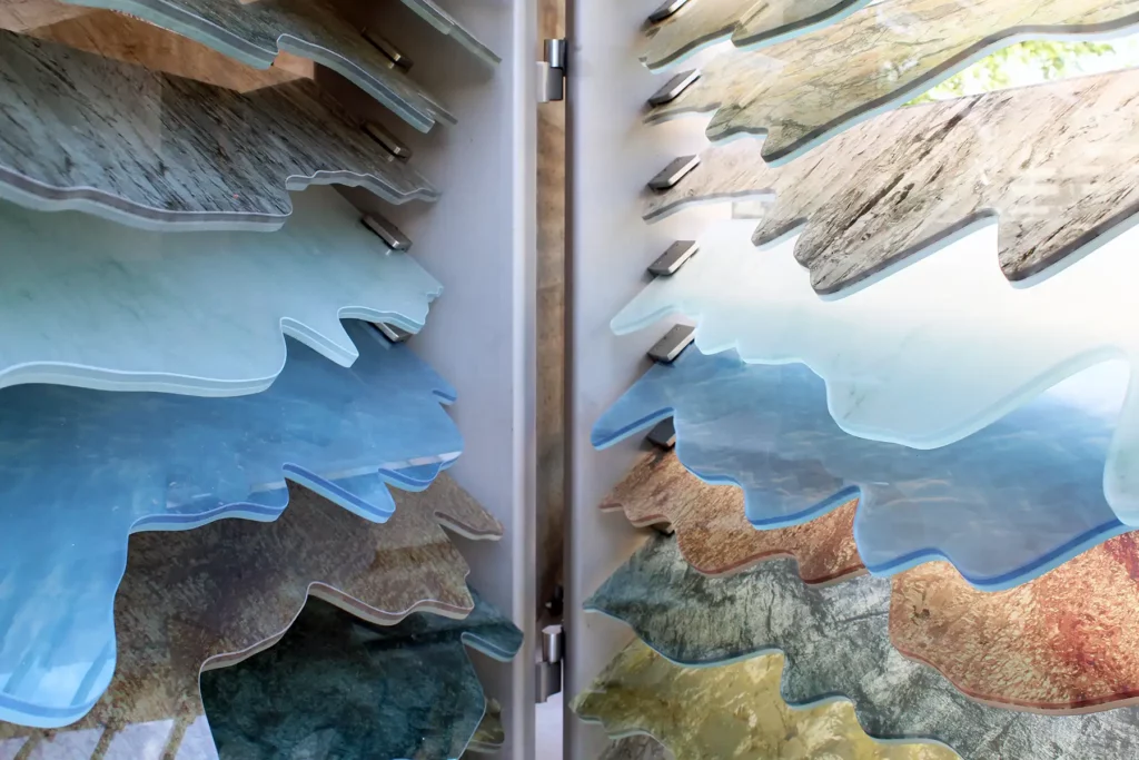 Detail of the artwork Mine Craft, which shows the topography of the state of Colorado using multi-colored panes of glass.